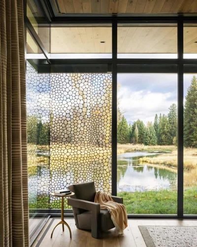 A steel and glass pavilion offers a serene guest house in Wyoming